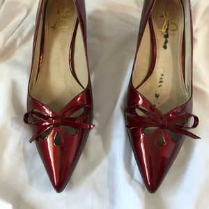 Red patent leather pumps